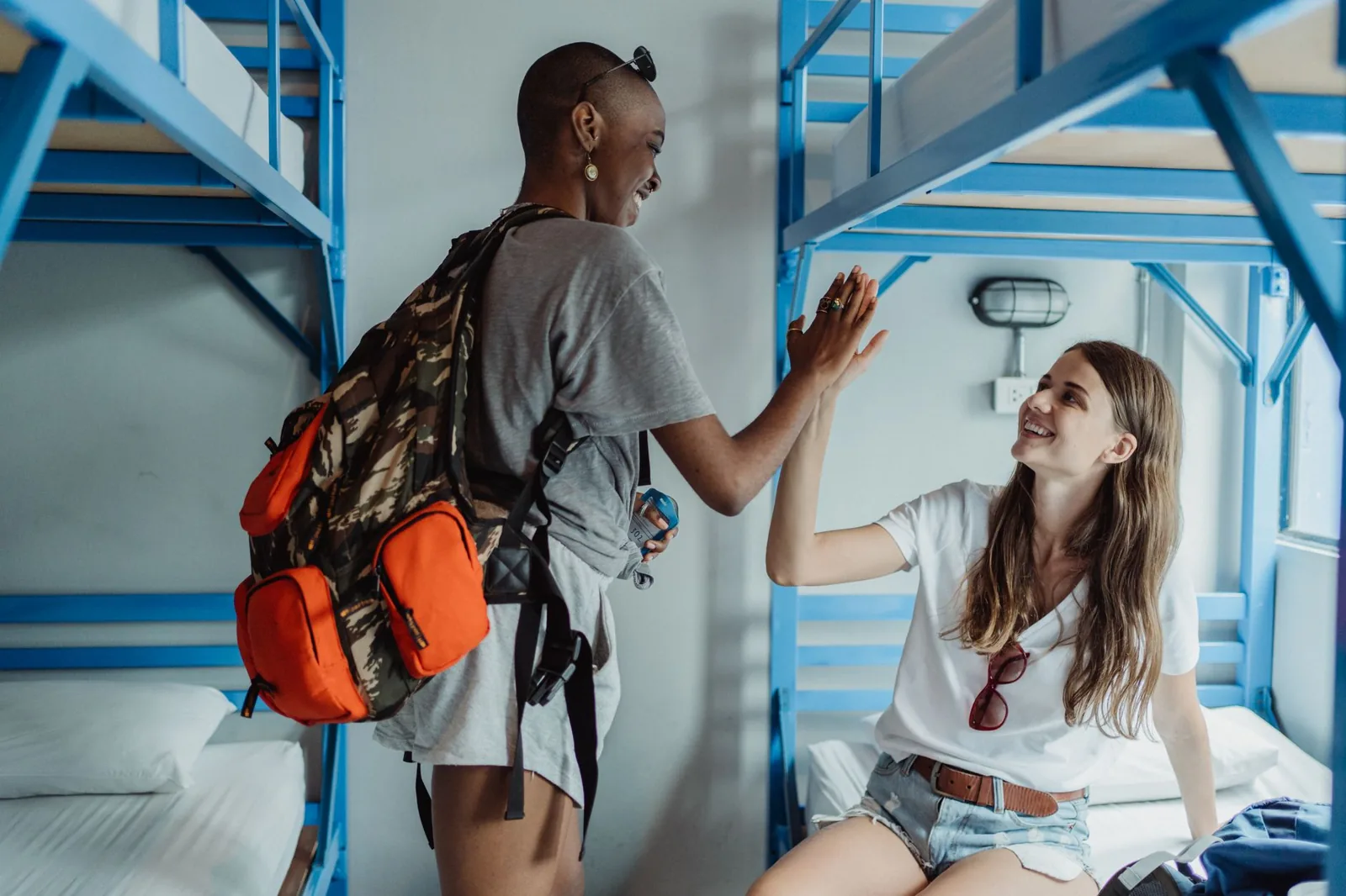 Hostel vs Airbnb cost comparison showing a hostel dorm versus a private apartment